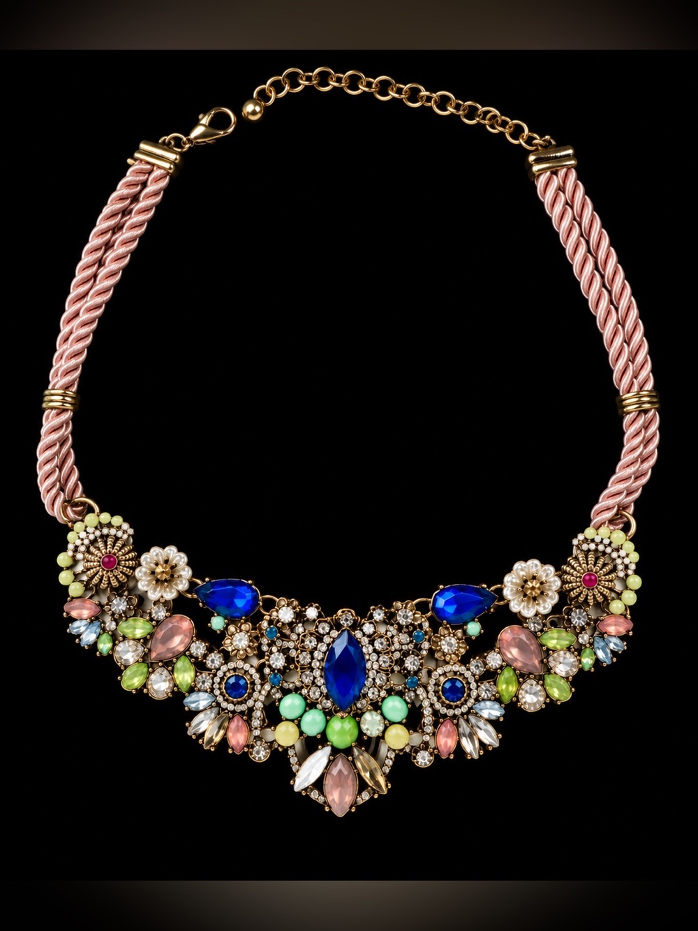 Multicolored rhinestone floral statement necklace. Gold tone with pink cord 20"